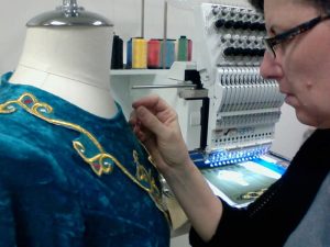 BJ from Irish Seams doing alterations on a dress.