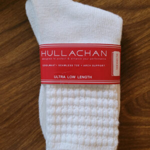 A pair of Hullachan poodle socks with a red label
